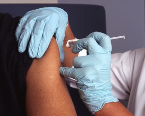 Person getting COVID-19 vaccine